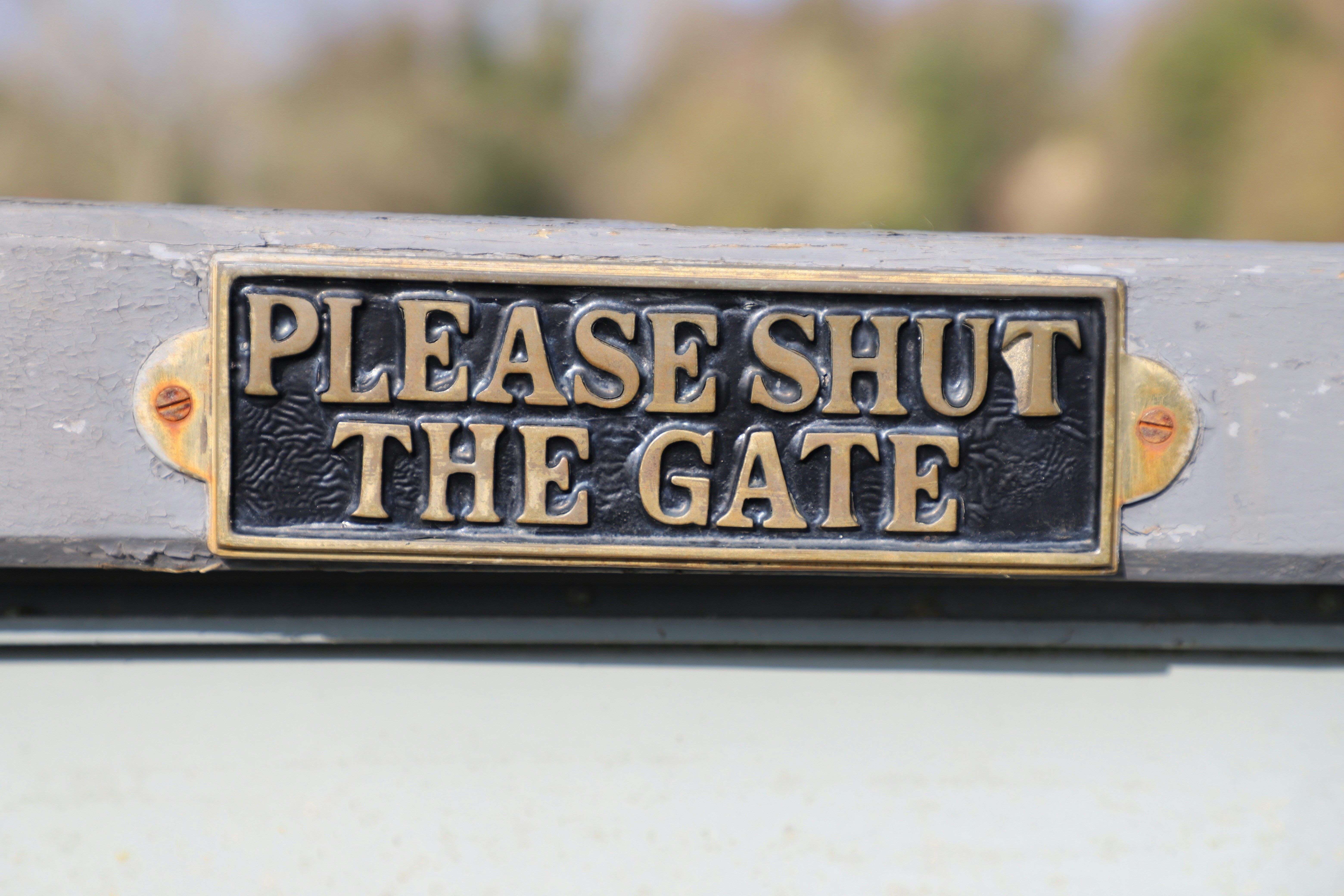 A gate with a 'please shut the gate' sign on (Unsplash: Dave Lowe)